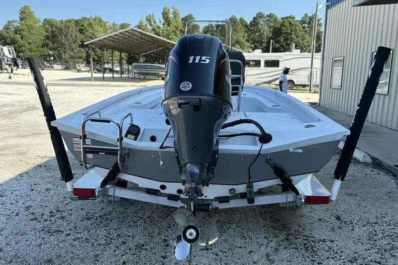 Slide: The Image of 2026 Xpress H20B boat with 115 horsepower engine, parked outdoors. - 4