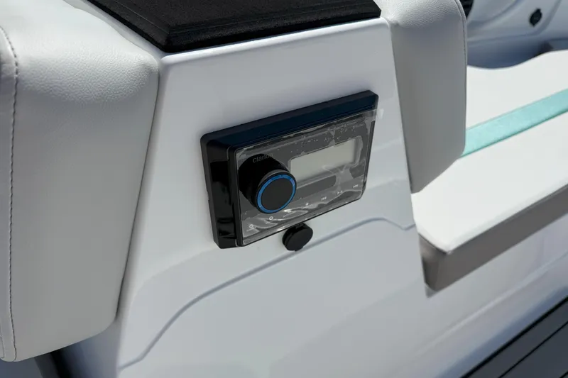 Slide: The Image of 2026 Hurricane SunDeck Sport 185 OB boat console with audio control panel. - 14