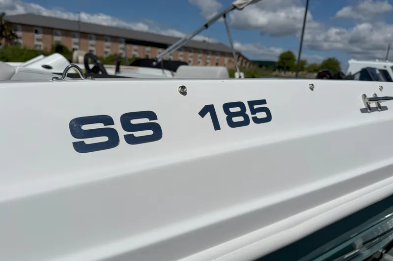 Slide: The Image of 2026 Hurricane SunDeck Sport 185 OB boat, close-up of SS 185 lettering. - 15