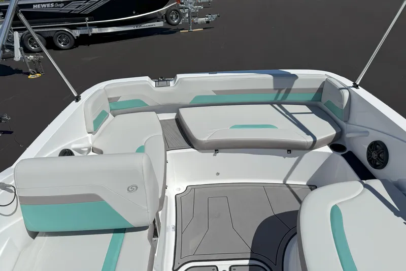 Slide: The Image of 2026 Hurricane SunDeck Sport 185 OB boat interior with teal and gray seating, spacious layout. - 8