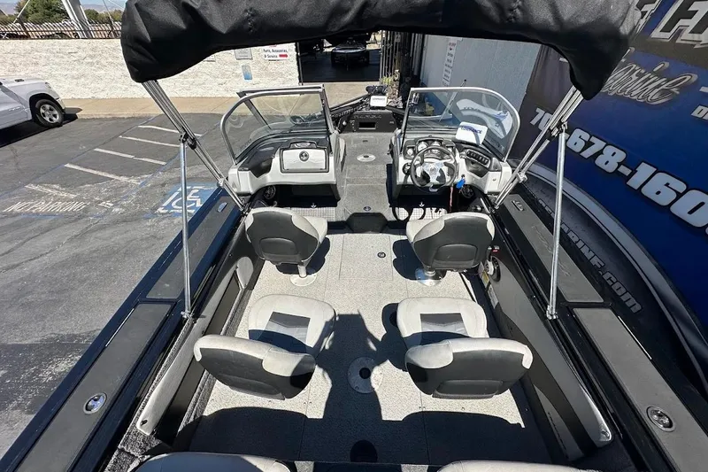 Slide: The Image of 2018 Tracker Targa V-19 Combo boat interior with seating and steering console. - 11