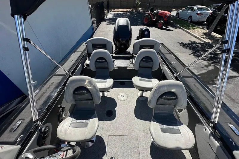 Slide: The Image of 2018 Tracker Targa V-19 Combo boat interior with seating and steering wheel. - 14