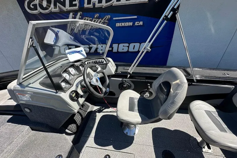 Slide: The Image of 2018 Tracker Targa V-19 Combo boat interior with steering wheel and seats. - 15