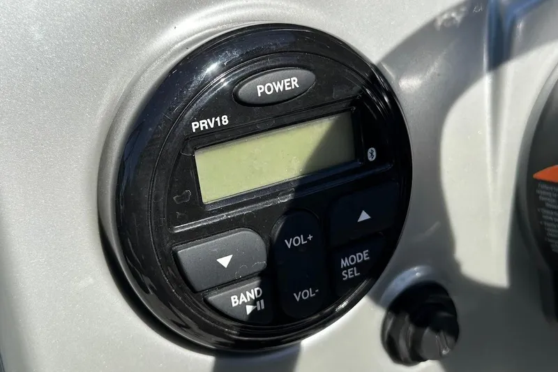 Slide: The Image of Close-up of a 2018 Tracker Targa V-19 Combo boat stereo system. - 19