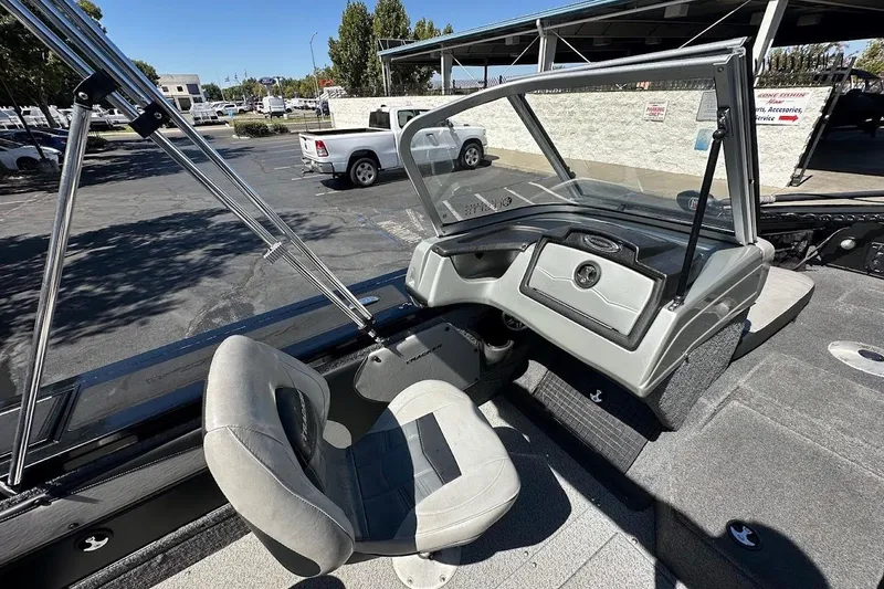 Slide: The Image of 2018 Tracker Targa V-19 Combo boat interior with seating and dashboard view. - 20