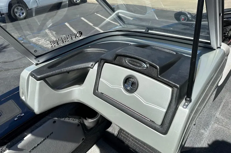 Slide: The Image of 2018 Tracker Targa V-19 Combo boat dashboard with windshield and storage compartment. - 21