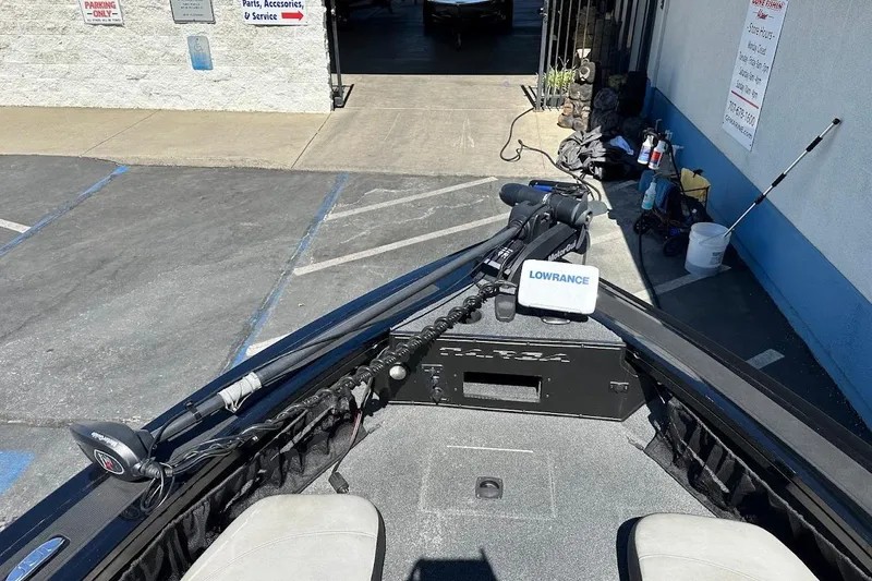 Slide: The Image of 2018 Tracker Targa V-19 Combo boat with Lowrance equipment in a parking area. - 25