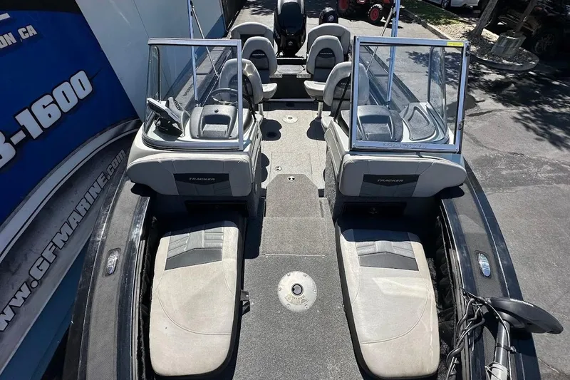 Slide: The Image of 2018 Tracker Targa V-19 Combo boat interior with seating and windshield. - 27