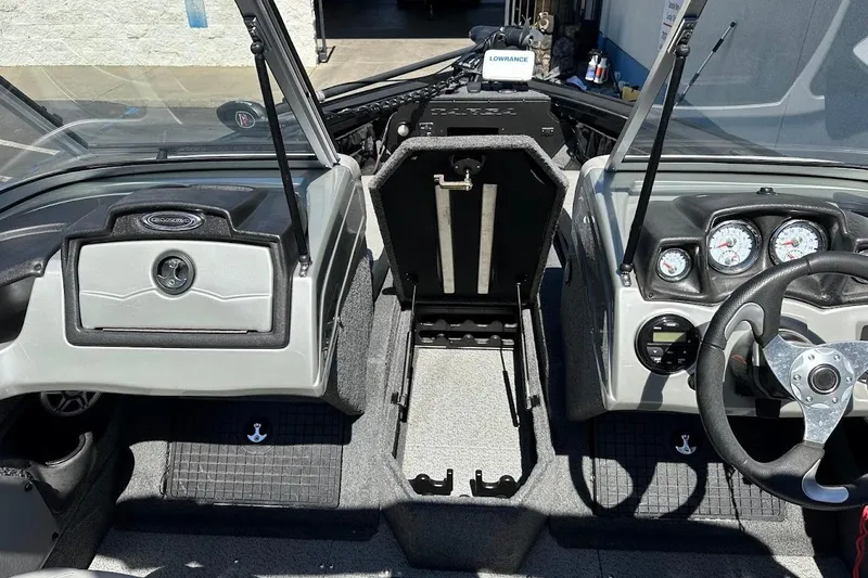 Slide: The Image of 2018 Tracker Targa V-19 Combo boat interior with steering wheel and dashboard controls. - 28