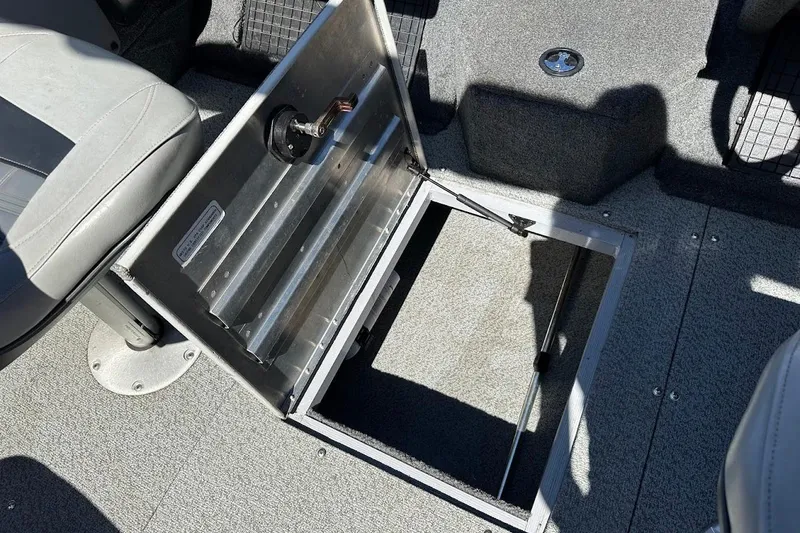 Slide: The Image of 2018 Tracker Targa V-19 Combo boat with open storage compartment. - 30