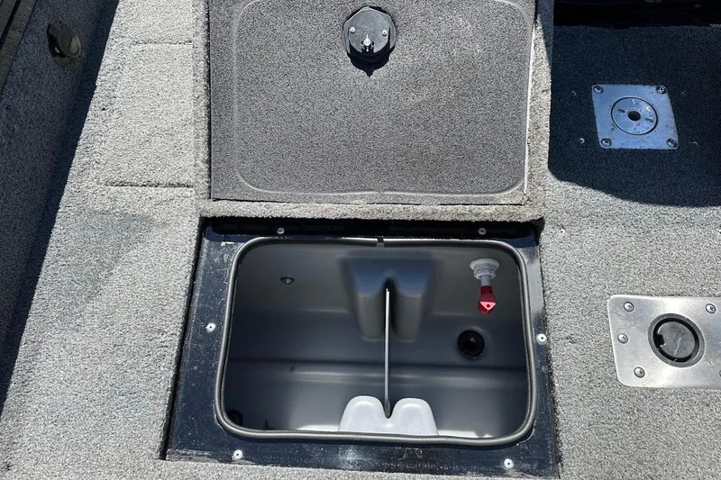 Slide: The Image of 2018 Tracker Targa V-19 Combo boat storage compartment with open hatch. - 37