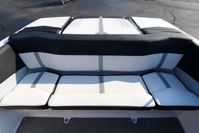 Slide: The Image of 2013 Four Winns H190 boat interior with cushioned seating, black and white design. - 13