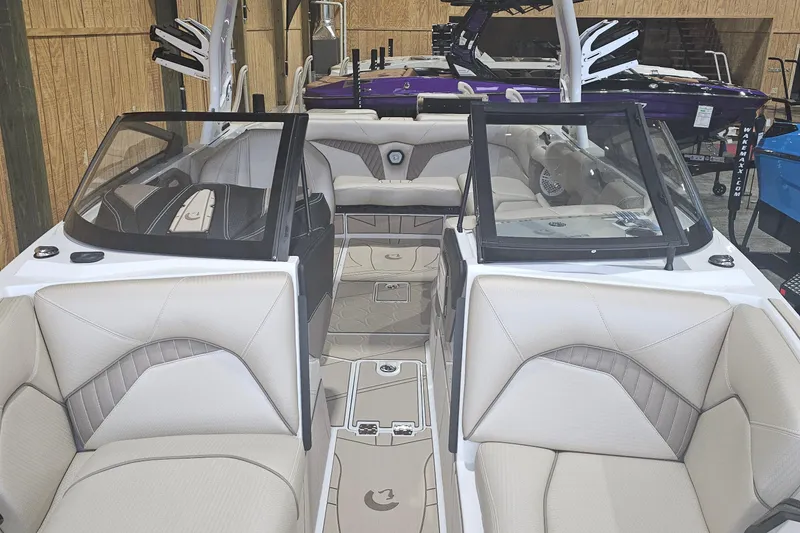 Slide: The Image of 2024 Centurion Fi23 boat interior with beige seating and modern design. - 4