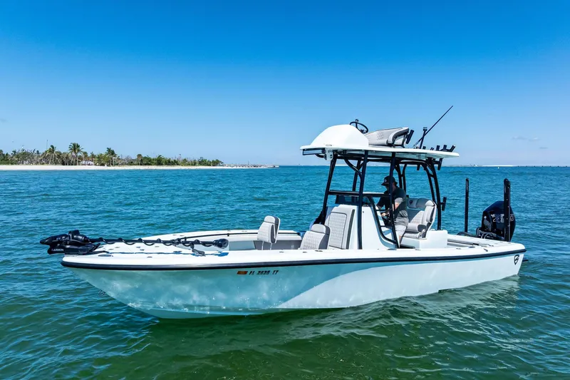 The Image of 2020 Barker Boatworks 26 Open on calm blue water near a tropical shoreline. - 0