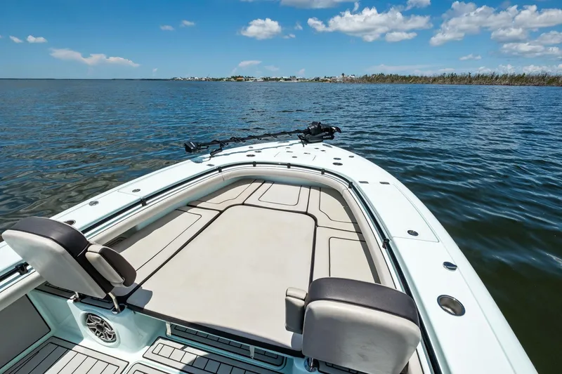Slide: The Image of 2020 Barker Boatworks 26 Open on calm water under blue sky. - 12