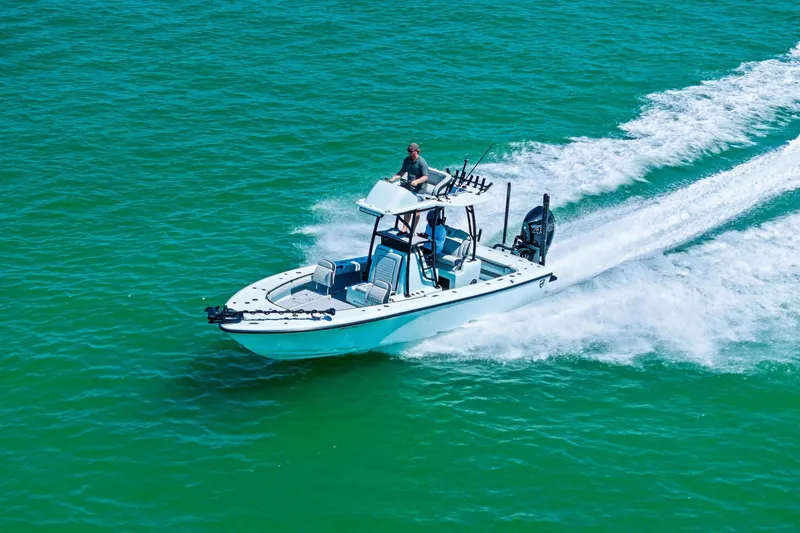 Slide: The Image of 2020 Barker Boatworks 26 Open cruising on clear turquoise water. - 26
