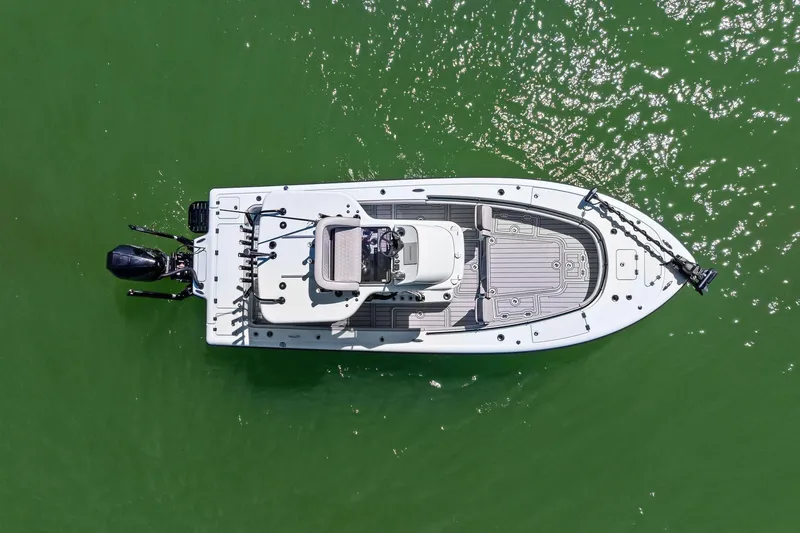 Slide: The Image of Overhead view of 2020 Barker Boatworks 26 Open on green water. - 3