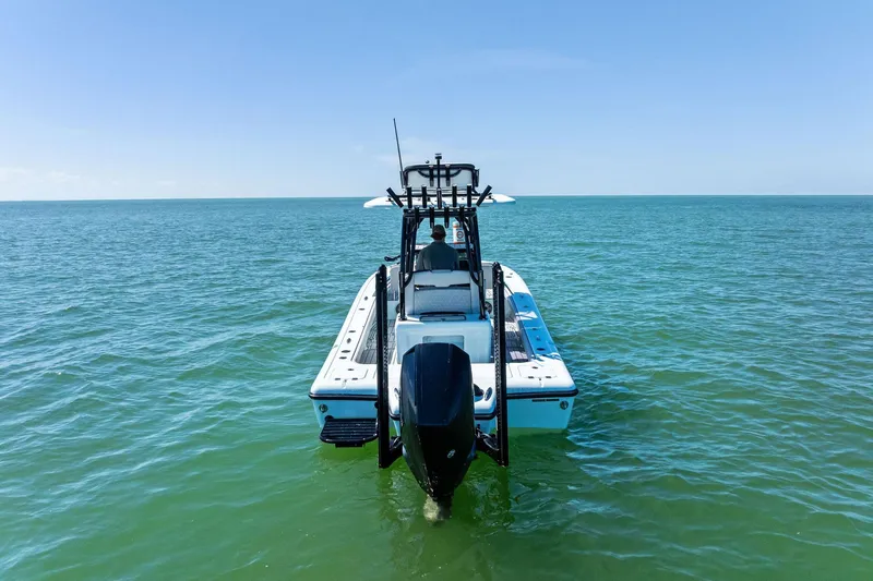 Slide: The Image of 2020 Barker Boatworks 26 Open on calm ocean waters, rear view. - 4