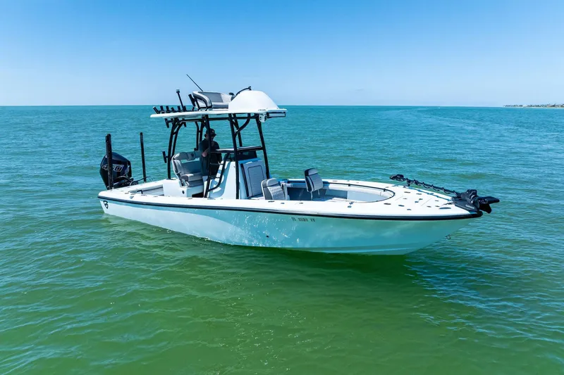 Slide: The Image of 2020 Barker Boatworks 26 Open on calm sea, showcasing sleek design and modern features. - 6