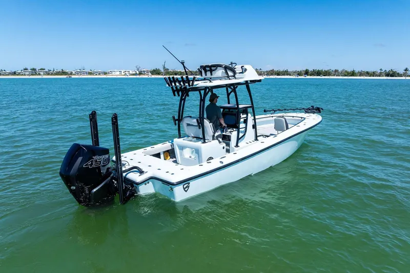 Slide: The Image of 2020 Barker Boatworks 26 Open on calm water, featuring powerful outboard engine. - 7