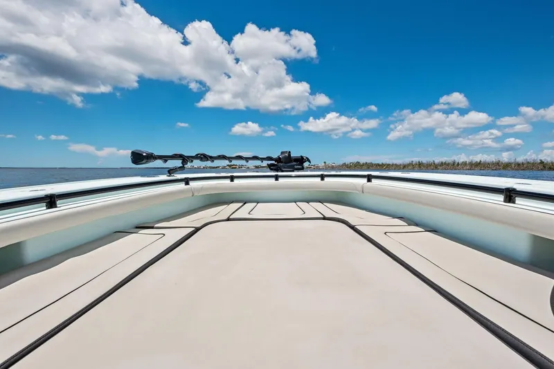 Slide: The Image of 2020 Barker Boatworks 26 Open deck with clear blue sky and water view. - 14