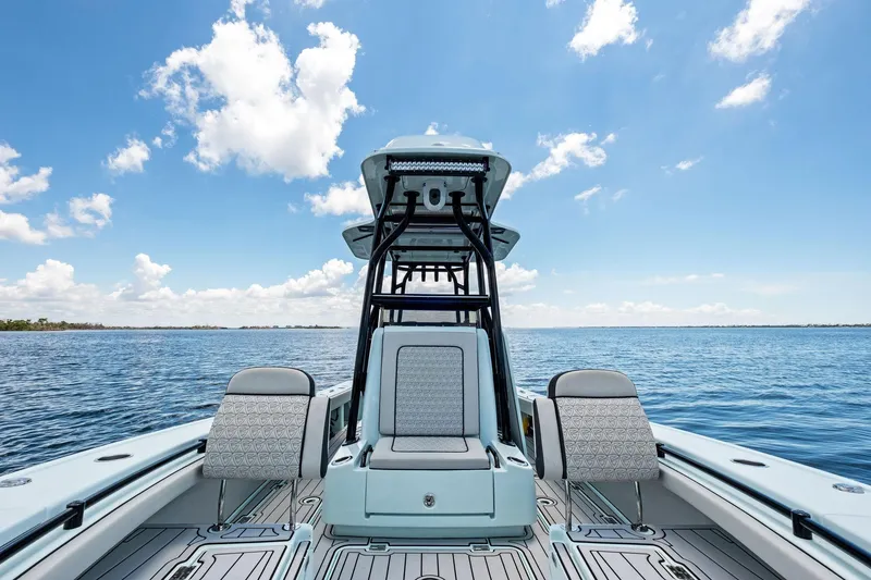Slide: The Image of 2020 Barker Boatworks 26 Open on calm ocean with clear blue sky. - 16