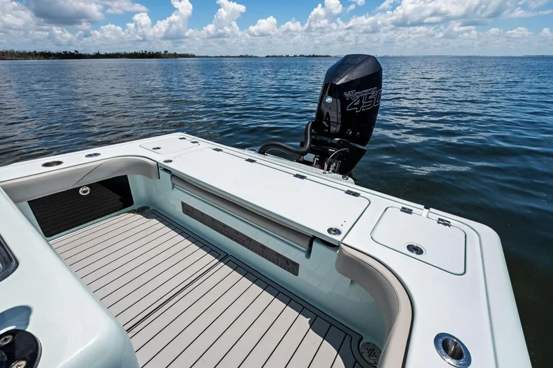 Slide: The Image of 2020 Barker Boatworks 26 Open on water, featuring spacious deck and powerful outboard motor. - 23