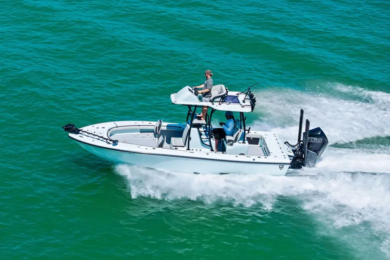 Slide: The Image of 2020 Barker Boatworks 26 Open cruising on clear blue water. - 30