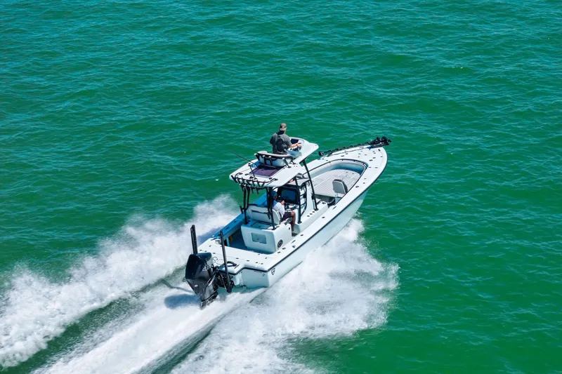 Slide: The Image of 2020 Barker Boatworks 26 Open cruising on clear blue water. - 33