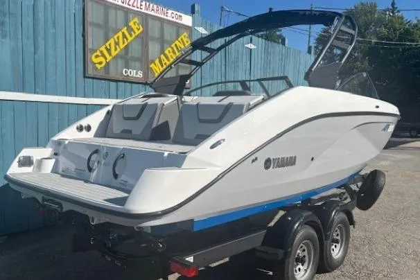 Slide: The Image of 2026 Yamaha Boats AR220 on trailer at Sizzle Marine dealership. - 2