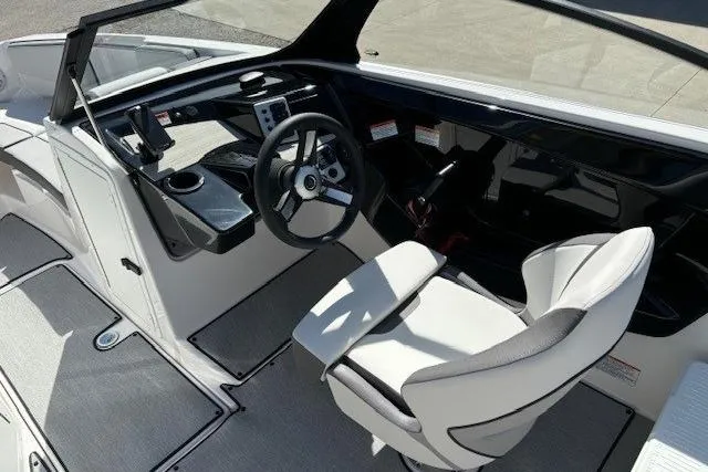 Slide: The Image of 2026 Yamaha Boats AR220 cockpit with modern steering and seating design. - 7