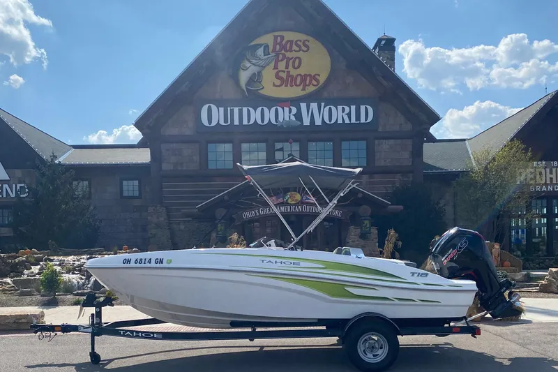 The Image of 2024 Tahoe T18 boat on trailer outside Bass Pro Shops Outdoor World. - 0