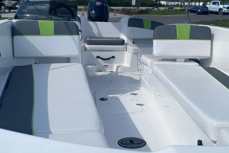 Slide: The Image of 2024 Tahoe T18 boat interior with white and green seating, showcasing spacious layout. - 3
