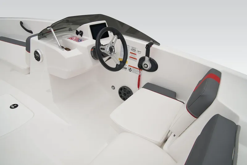 Slide: The Image of 2024 Tahoe T18 boat interior with steering wheel, seating, and control panel. - 8