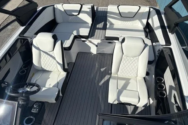 Slide: The Image of 2026 Yamaha Boats 222S interior with white seating and modern design. - 10