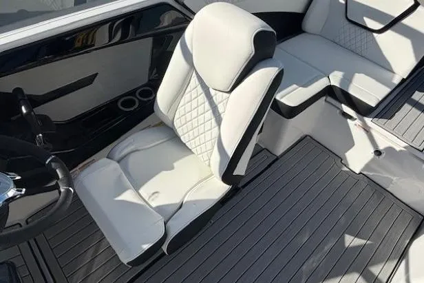 Slide: The Image of Luxurious interior of 2026 Yamaha Boats 222S with white seating and sleek design. - 11