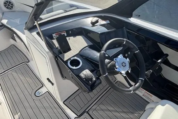 Slide: The Image of 2026 Yamaha Boats 222S cockpit with steering wheel and modern controls. - 13