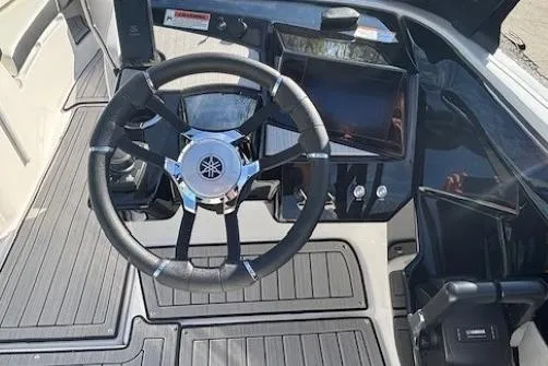 Slide: The Image of 2026 Yamaha Boats 222S steering wheel and dashboard, featuring modern controls and sleek design. - 14