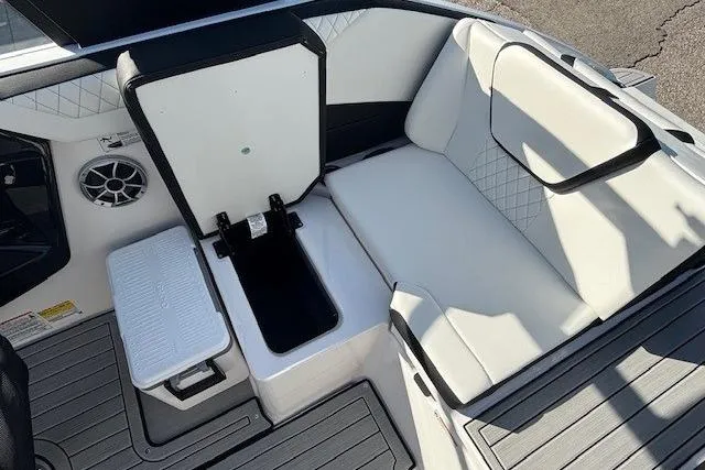 Slide: The Image of 2026 Yamaha Boats 222S interior with white seating and storage compartment. - 17