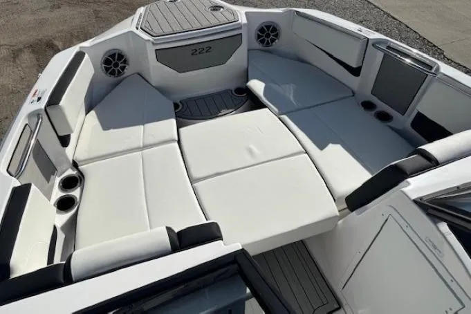 Slide: The Image of 2026 Yamaha Boats 222S interior with spacious white seating and cup holders. - 8