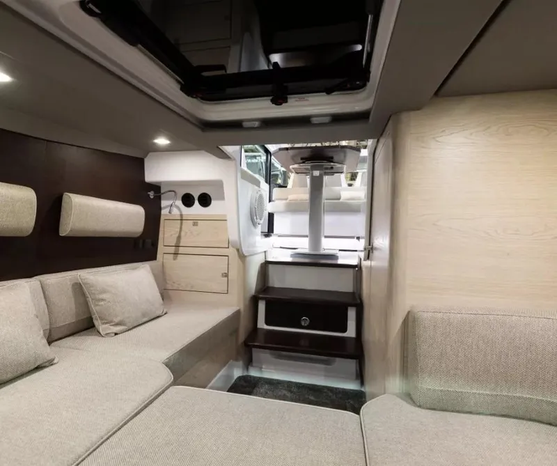 Slide: The Image of Luxurious interior of 2025 Axopar 45 Cross Top boat with modern seating and elegant design. - 13