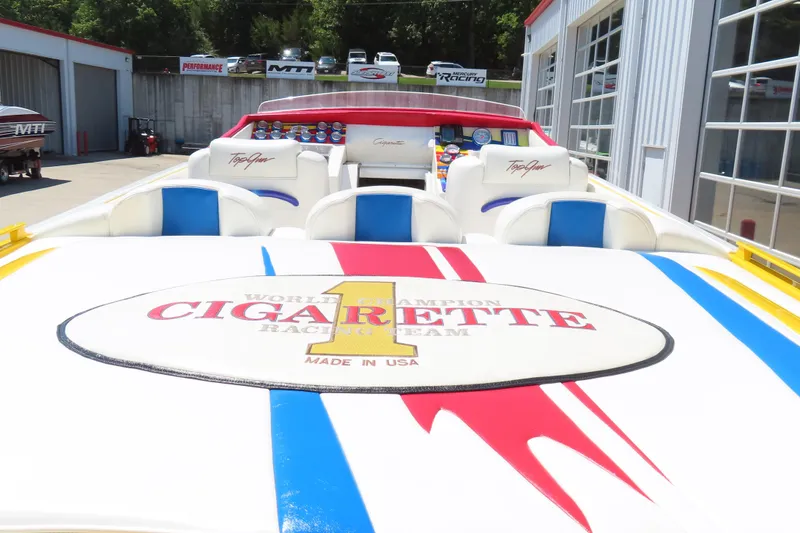 Slide: The Image of 2003 Cigarette 38 Top Gun boat interior with vibrant racing design and logo. - 12