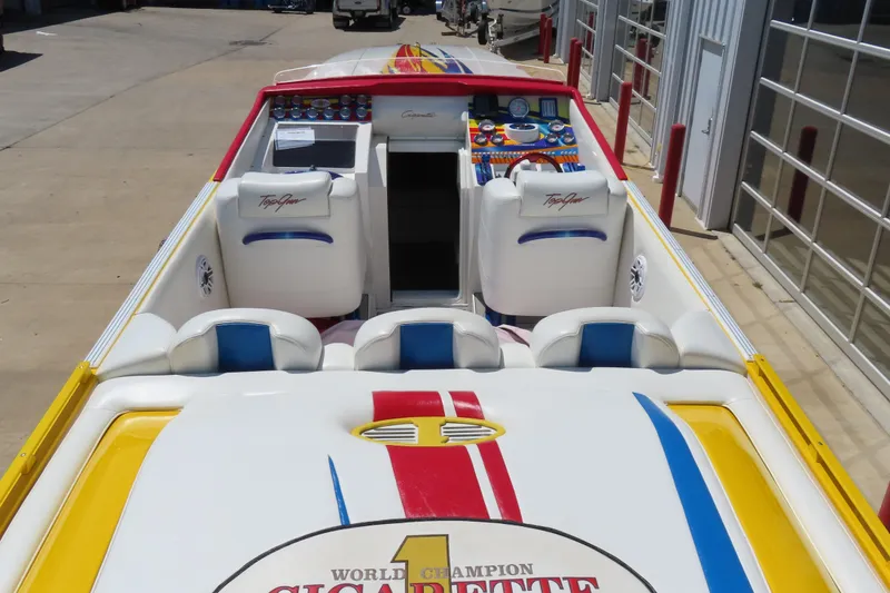 Slide: The Image of 2003 Cigarette 38 Top Gun speedboat with colorful interior and sleek design. - 14