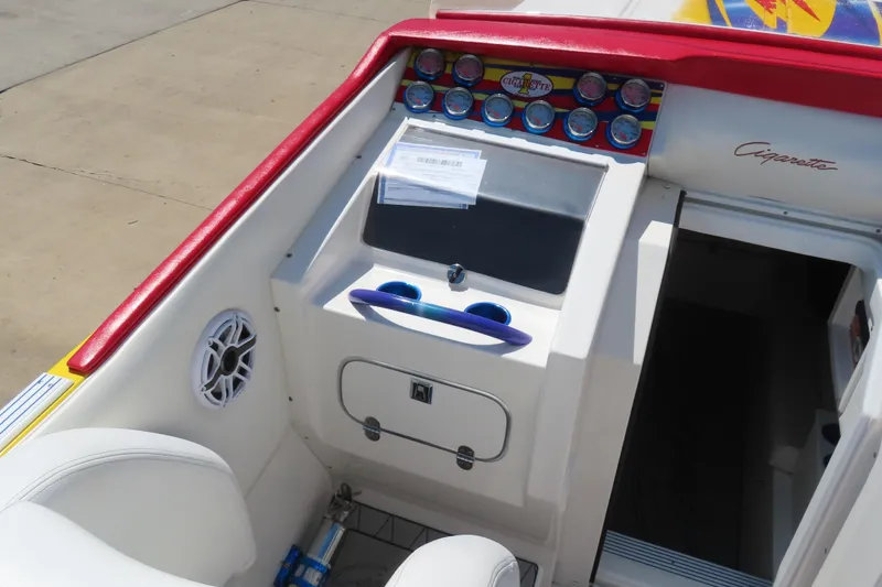 Slide: The Image of 2003 Cigarette 38 Top Gun boat interior with dashboard and seating area. - 17