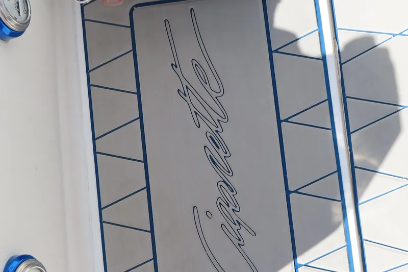 Slide: The Image of 2003 Cigarette 38 Top Gun boat interior with logo and blue accents. - 18