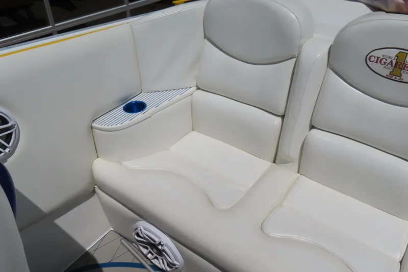 Slide: The Image of 2003 Cigarette 38 Top Gun boat interior with white leather seating and cup holder. - 24