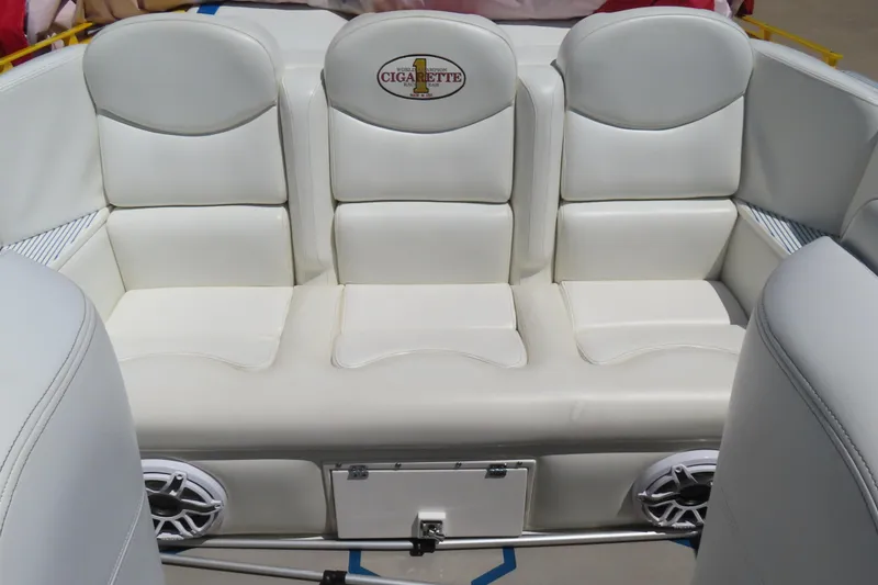 Slide: The Image of 2003 Cigarette 38 Top Gun boat interior with white leather seating and speakers. - 25