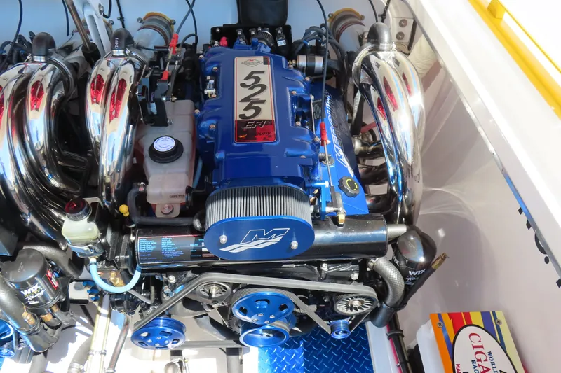 Slide: The Image of 2003 Cigarette 38 Top Gun engine with blue and chrome components, showcasing high-performance design. - 27