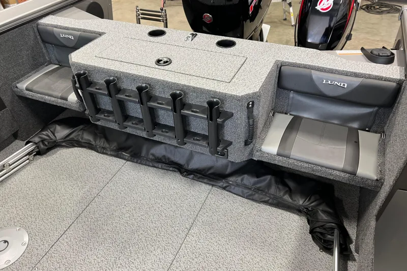 Slide: The Image of 2026 Lund 1875 Fisherman boat interior with rod holders and seating. - 14