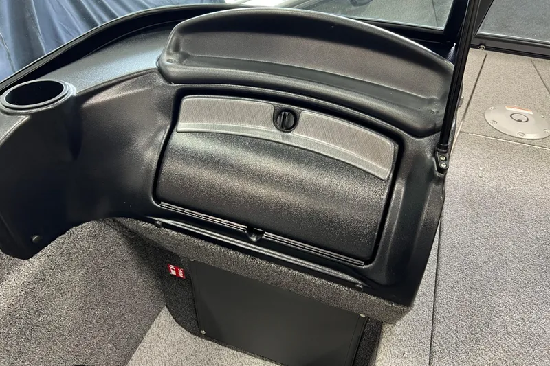 Slide: The Image of 2026 Lund 1875 Fisherman boat interior, featuring a sleek dashboard and storage compartment. - 23